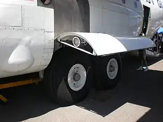 High-wing cargo aircraft often have compartments similar to sponsons for the main gear.