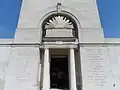 The inscriptions in English and French either side of the memorial tower entrance