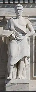 Marble statue of man in toga holding scroll