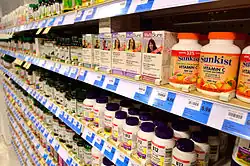 Rows and rows of dietary supplement bottles on shelves