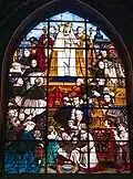 Stained glass window of the coronation of "Our Lady of Assistance”