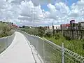 The cycleway along a container freight depot.