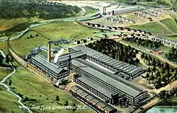 A postcard depicting a large factory.