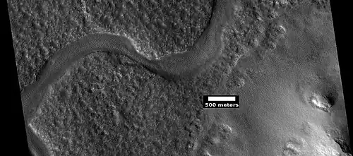 Curved channel in Lyot crater, as seen by HiRISE under HiWish program