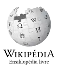 Wikipedia logo displaying the name "Wikipedia" and its slogan: "The Free Encyclopedia" below it, in Tetum