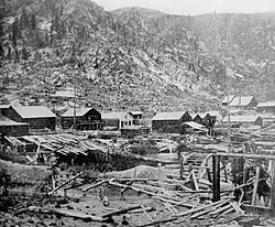 Lumber under snow in Montgomery, Colorado, 1880s