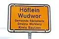 Bilingual road sign for Höflein/Wudwor