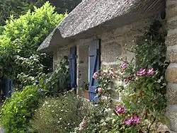 Image 63Roses, clematis, a thatched roof: a cottage garden in Brittany (from Garden design)