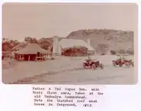 Gerhardt Johannsen and Ted Hayes Senior with their first cars at the Undoolya Station homestead, 1923