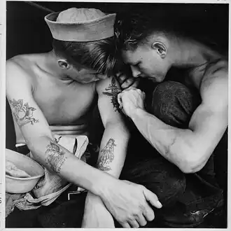 Much tattooed sailor aboard the USS New Jersey [Dec 1944][15]
