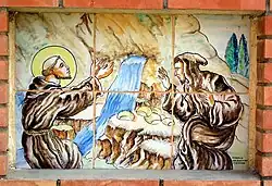 Plafón cerámico representando a san Francisco de Asís a la entrada del Vía Crucis de Casas Altas (Valencia), siglo&nbsp;XX