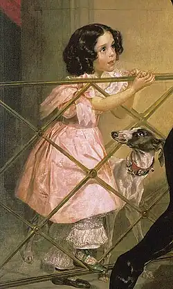 La niña en la barandilla.