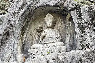 Escultura en las Grutas de Feilaifeng