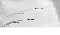 L. Marcas recientes oscuras y marcas antiguas más claras, ubicadas en el cuadrángulo Diacria (imagen HiRISE, programa HiWish).