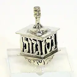 Dreidel de cuatro caras