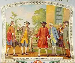 A painting shows men standing outside a yellow building; the men are dressed in revolutionary clothing with tri-pointed hats and powdered wigs.