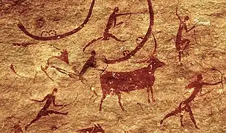 Figuras humanas con arcos y animales