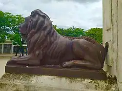 Lion Bronze Statue and part of Christopher Columbus Statue Monument in Colón, Cuba