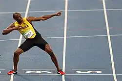 El atleta jamaicano Usain Bolt celebra con su característica pose la victoria en los 200 metros en Río de Janeiro de 2016.