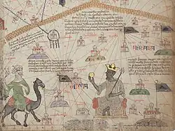 El rey Mansa Musa y un viajero a camello ilustran la zona sahariana del Atlas catalán.