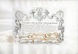 Acción de la Companhia Real de Toledo unida a la de Extremadura por 3000 reales vellón, emitida el 6 de diciembre de 1751 en Toledo, impresa en pergamino de becerro. La compañía, fundada en 1748, explotaba plantaciones de moreras y cría de gusanos de seda, producía seda y también comerciaba con armas.