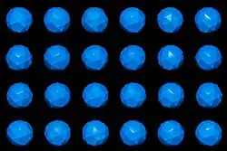 five coloured polyhedra mounted on vertical axes