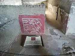 Mural que representa a un pescador de moluscos en el complejo de Tetitla