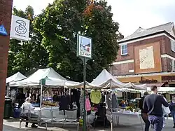 Sunday market and the Eltham town sign