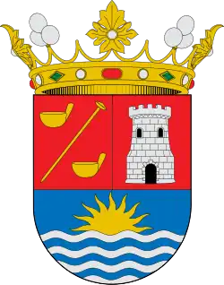 En el escudo de Adeje figura a la izquierda de la torre: de gules, una añepa puesta en barra acompañada de dos gánigos, todo de oro.