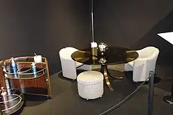 Jamaica cabinet Eugenio Gerli design 1966; Ps 142 Clamis armchairs 1966; T69 table design Gerli-Borsani 1963