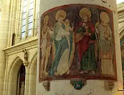 Fresco de comienzos del siglo&nbsp;XVI (de izquierda a derecha: Juan Bautista, Santa María con el niño Jesús, San Juan Evangelista, San Didier sosteniendo su cabeza decapitada). Se ve un pasaje de Champagne en el pilar lateral en alto a la izquierda.