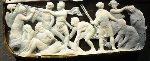 Soldados romanos erigiendo un trophaeum representados en la Gemma Augustea.[17]​