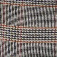 Cuadriculado Príncipe de Gales, utilizado con frecuencia para hacer sobretodos y chaquetas deportivas en la década de los 1950.