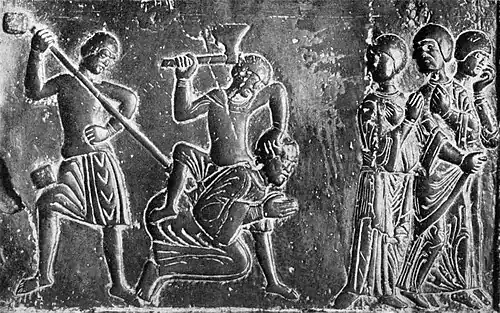 Representación medieval de los prusianos matando a San Adalberto, obispo misionero; parte de las Puertas de Gniezno, c.&nbsp;1175.