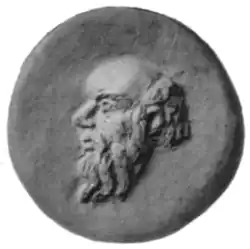 Cabeza de Sileno en relieve, posiblemente utilizado como molde o troquel en cerámica, de época romana.[20]​