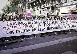 Mujeres africanas y afrodescendientes en una manifestación en contra de la trata de mujeres afro