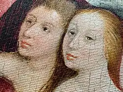 Detalle de una impresión giclée del cuadro "El jardín de las delicias" que muestra dos rostros femeninos con tonos precisos y texturas realistas.