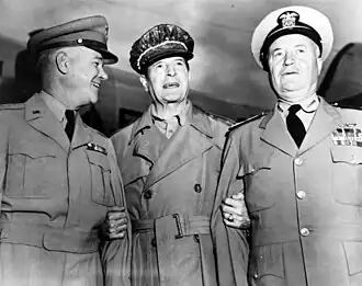 Three men in neat uniforms smiling. MacArthur is wearing his distinctive cap and no tie.
