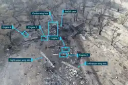 Close-up aerial image depicting the main aircraft wreckage components