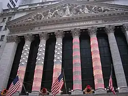 Photograph of the columns of the NYSE lit up for Christmas