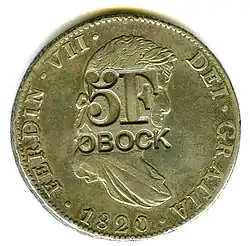 Anverso de moneda de 8 reales (plata) de Fernando VII de 1820 con resello de Obock (Yibuti).