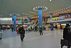 Penn Station concourse with escalators and stairs in the background