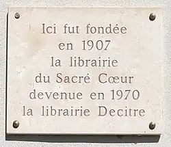 Placa conmemorativa de la Librería del Sacré-Cœur, plaza de Bellecour, Lyon.