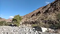 Ruins of the old village of Mazdiya - Ancient dry-stone buildings on the banks of the Wadi Al Helo