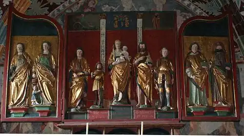 Tríptico escultórico (abierto) en la iglesia de Sogn Gieri (Suiza, siglo XIV).[79]​