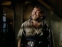 Thomas Mitchell como Tom Blue