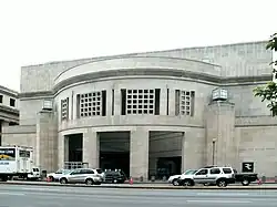 14th Street Entrance of USHMM. Large, rectangular façade with rounded opening.